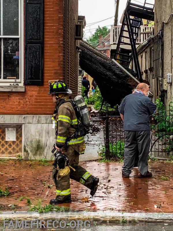 Tropical Storm Isaias response to tree into a building on High Street in West Chester Borough